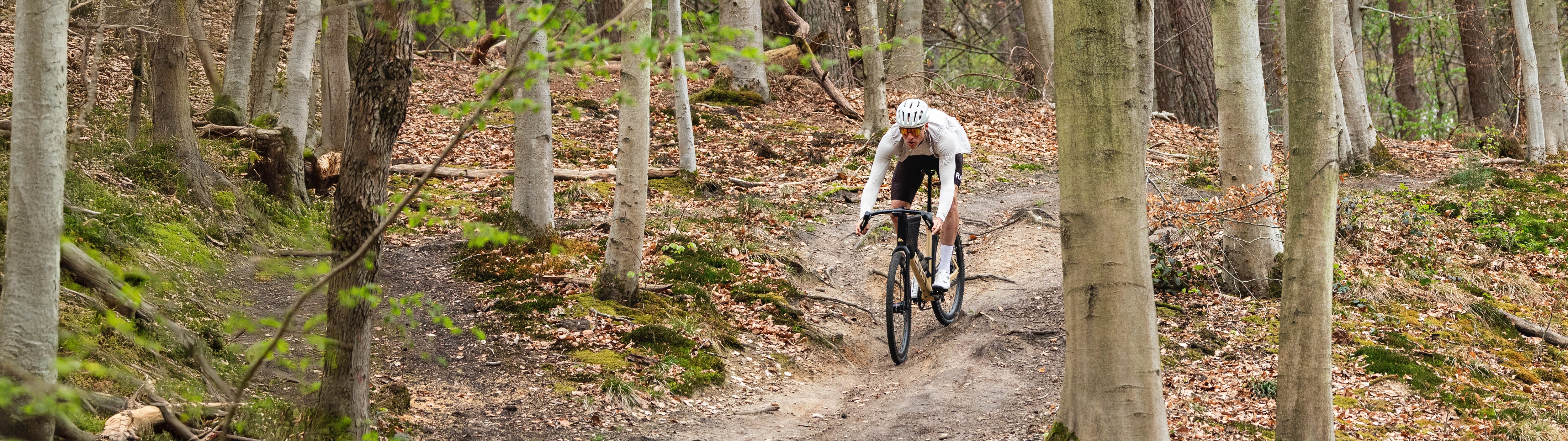 A rider enjoying Grava on a forest trail.