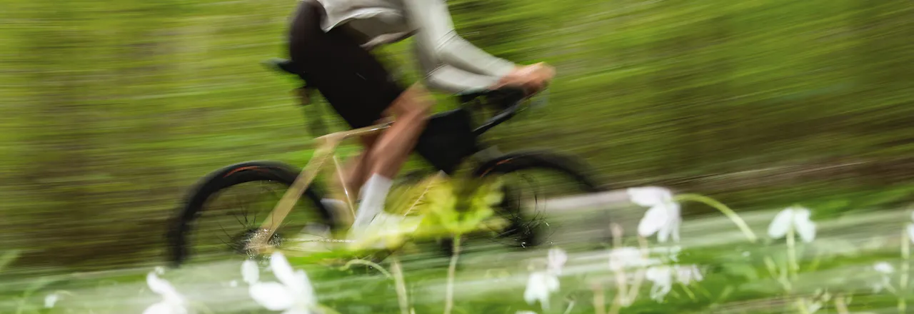 A fast rider enjoying Gravaa in a forest.